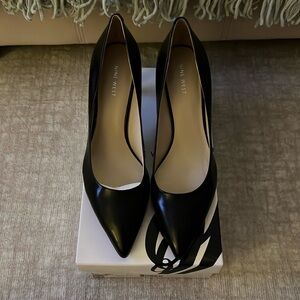Black leather size 9.5 Nine West pumps. New. Never worn.